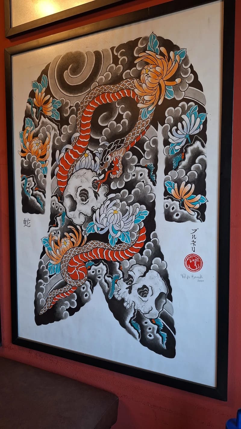 Desenho tradicional de caveiras e serpente feito à mão por Felipe Brunelli